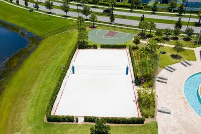an overhead view of a tennis court next to a pool at Lovely Condo Access to Amazing Resort STL115 in Kissimmee
