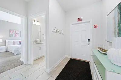 a bathroom with a white door and a sink at Really close to Disney! Sleeps 10 - STL116 in Kissimmee
