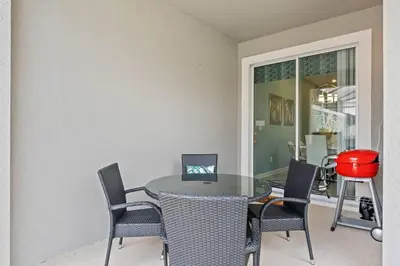 a dining room with a table and chairs at Lovely Family Home - 8 Min to Disney! - STL106 in Kissimmee