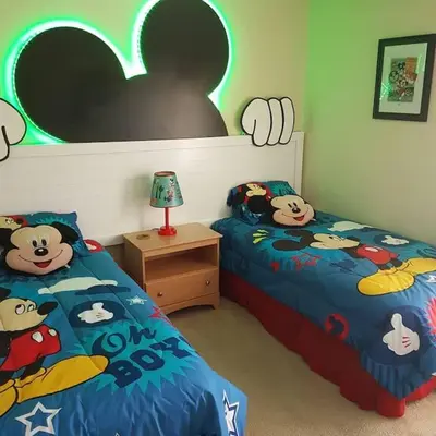 a bedroom with two beds with hello kitty comforters at Florida Jewels - beautiful villa on Emerald Island in Kissimmee
