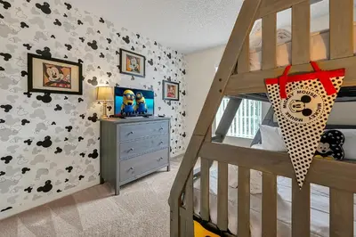 a childs bedroom with a bunk bed and a staircase at Esmerald Island Resort Oasis: Your Perfect Getaway Near Disney in Kissimmee
