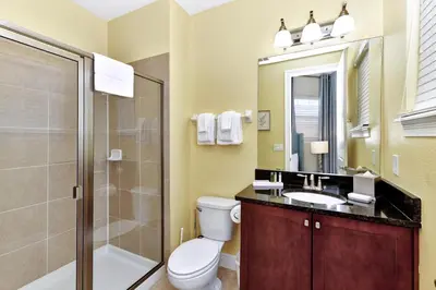 a bathroom with a toilet and a sink and a shower at Gorgeous Home With Private Pool, Game Room Near Disney With Waterpark & Resort Access At Encore Resort - 781La in Kissimmee