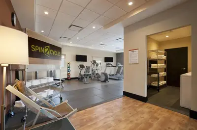 a gym with treadmills and exercise equipment in a building at Home2 Suites By Hilton Winter Garden in Orlando