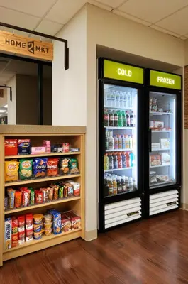 two refrigerators in a store with food inside at Home2 Suites By Hilton Winter Garden in Orlando