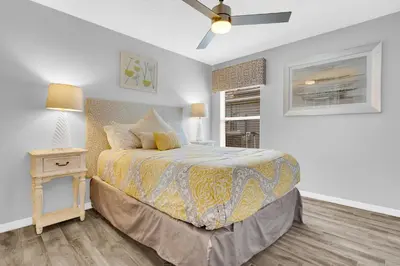 a bedroom with a bed and a ceiling fan at South Facing Pool with Spa and a Game Room in Prime Location Near Disney in Kissimmee