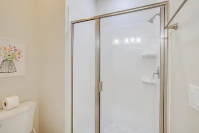 a glass shower door in a bathroom with a toilet at Kissimmee Getaway with Pool Access 5 Mi to Disney in Kissimmee