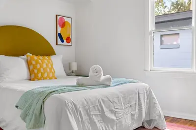a bedroom with a bed with a stuffed animal on it at Fire Pit + Grill + 2MI to DT Orlando in Orlando