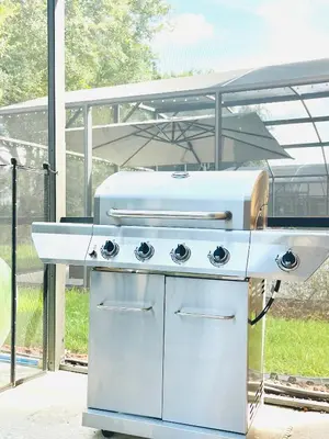 a white grill sitting in front of a tent at Enchanted Hideaway in Kissimmee