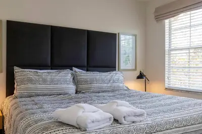 a bedroom with two white towels on a bed at Amazing Townhouse for 6 people near Disney in Kissimmee