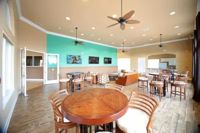 a dining room with a table and chairs at Top Villas - Bella Vida Resort 203 in Kissimmee