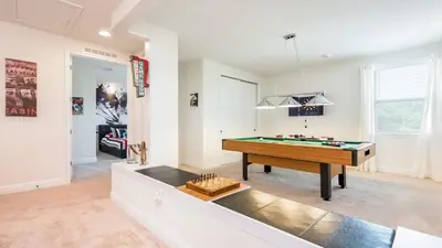 a living room with a pool table in it at Last Minute Disney Getaway! Private Pool, Hot Tub & Games Room. Book Now! #60535 in Orlando