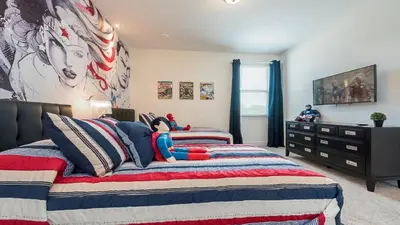 a bedroom with a bed with a superhero on it at Last Minute Disney Getaway! Private Pool, Hot Tub & Games Room. Book Now! #60535 in Orlando