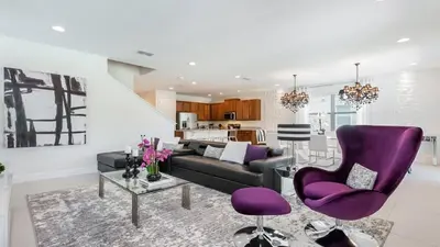 a living room with purple chairs and a couch at Last Minute Disney Getaway! Private Pool, Hot Tub & Games Room. Book Now! #60535 in Orlando