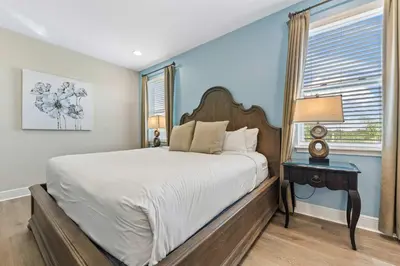 a bedroom with a large bed and a window at Last Minute Disney Getaway! Private Pool, Hot Tub & Games Room. Book Now! #39430 in Orlando