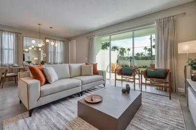 a living room with a couch and a table at Last Minute Disney Getaway Private Pool Themed Bedrooms. Book Now 81919 in Orlando