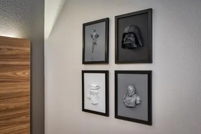 four framed pictures on a wall with at Last Minute Disney Getaway Private Pool Themed Bedrooms. Book Now 81919 in Orlando