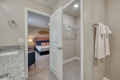 a bathroom with a walk in shower and a bedroom at Last Minute Disney Getaway Private Pool Themed Bedrooms. Book Now 81921 in Orlando
