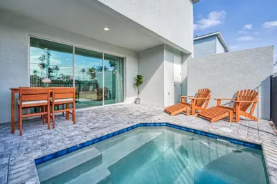 a house with a pool and a table and chairs at Last Minute Disney Getaway Private Pool Themed Bedrooms. Book Now 81953 in Orlando