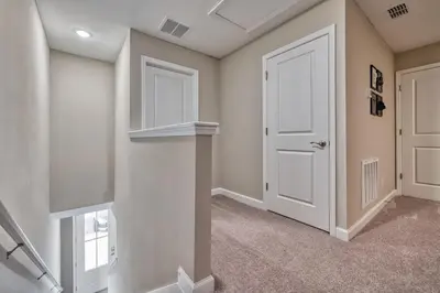 a hallway with a white door and a window at Last Minute Disney Getaway Private Pool Themed Bedrooms. Book Now 81915 in Orlando