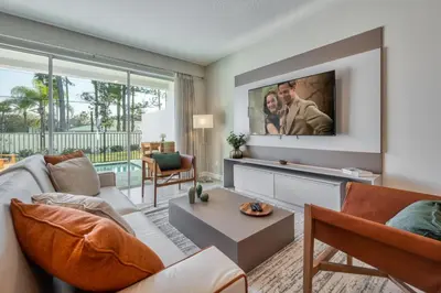 a living room with a couch and a tv at Last Minute Disney Getaway Private Pool Themed Bedrooms. Book Now 81911 in Orlando