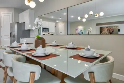 a dining room with a glass table and chairs at Last Minute Disney Getaway Private Pool Themed Bedrooms. Book Now 81907 in Orlando