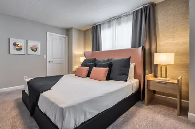 a bedroom with a large bed and a window at Last Minute Disney Getaway Private Pool Themed Bedrooms. Book Now 81951 in Orlando