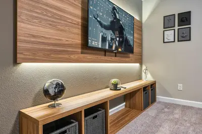 a room with a flat screen tv on a wall at Last Minute Disney Getaway Private Pool Themed Bedrooms. Book Now 91347 in Orlando