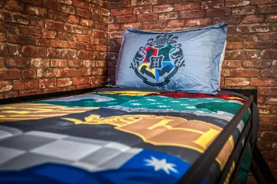 a bed in a room with a brick wall at Last Minute Disney Getaway Private Pool Themed Bedrooms. Book Now 91347 in Orlando