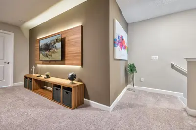 a living room with a wooden entertainment center in a house at Last Minute Disney Getaway Private Pool Themed Bedrooms. Book Now 81941 in Orlando