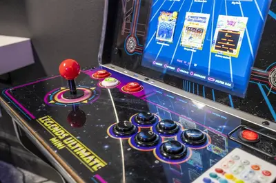 a pinball machine with a red ball on it at Last Minute Disney Private Pool Hot Tub Themed Bedrooms. Book Now 93745 in Kissimmee