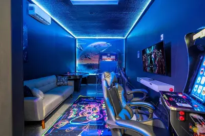 a living room with a video game system at Last Minute Disney Private Pool Hot Tub Themed Bedrooms. Book Now 93745 in Kissimmee
