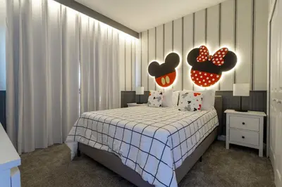 a bedroom with a bed with hearts on the wall at Last Minute Disney Getaway Private Pool Themed Bedrooms. Book Now 99589 in Kissimmee