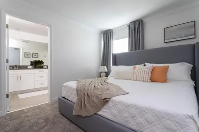 a bedroom with a large bed and a bathroom at Last Minute Disney Getaway Private Pool Themed Bedrooms. Book Now 99589 in Kissimmee