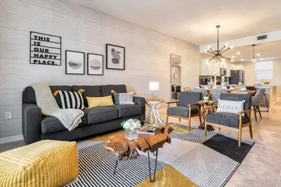 a living room with a couch and a table at Storey Lake Resort 1081 - Hosted by Top Villas in Kissimmee