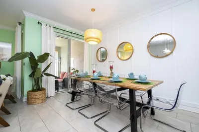 a dining room with a table and chairs at Storey Lake Resort 1082 - Hosted by Top Villas in Kissimmee