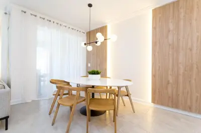 a dining room with a white table and chairs at Storey Lake Resort 1084 - Hosted by Top Villas in Kissimmee