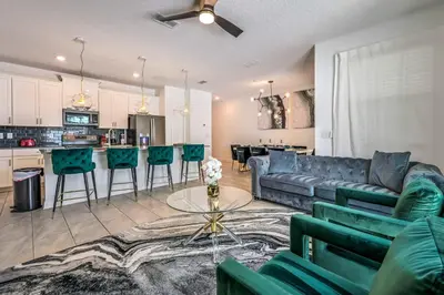 a living room with a couch and a table at Storey Lake Resort 1085 - Hosted by Top Villas in Kissimmee