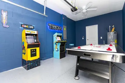 a room with a ping pong table and a video game at Storey Lake Resort 1086 - Hosted by Top Villas in Kissimmee