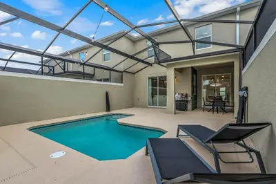 a swimming pool in a house with a roof at Storey Lake Resort 1088 - Hosted by Top Villas in Kissimmee