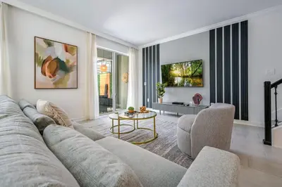 a living room with a couch and a table at Storey Lake Resort 1092 - Hosted by Top Villas in Kissimmee