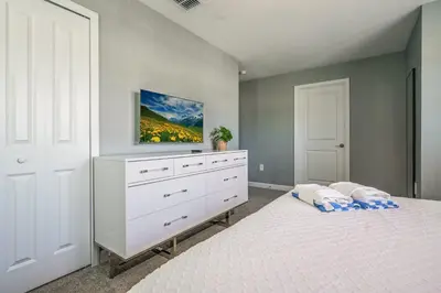 a bedroom with a white dresser and a bed at Storey Lake Resort 1092 - Hosted by Top Villas in Kissimmee