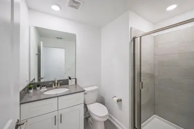 a bathroom with a toilet and a sink and a shower at Storey Lake Resort 1092 - Hosted by Top Villas in Kissimmee
