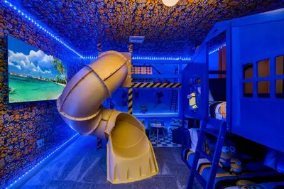 a room with a fake rocket in a blue room at Storey Lake Resort 1095 - Hosted by Top Villas in Kissimmee