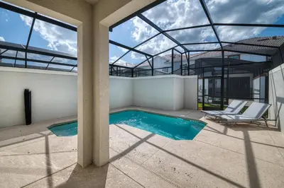 a swimming pool in a house with a glass ceiling at Storey Lake Resort 1107 - Hosted by Top Villas in Kissimmee