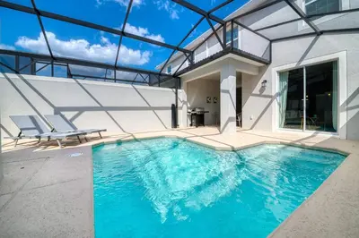 a swimming pool in a house with a glass ceiling at Storey Lake Resort 1107 - Hosted by Top Villas in Kissimmee
