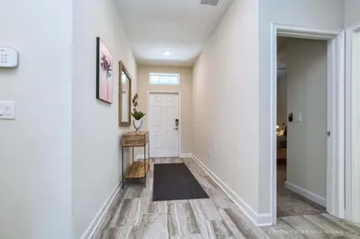 a hallway of a home with white walls at Storey Lake Resort 1110 - Hosted by Top Villas in Kissimmee