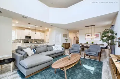 a living room with a couch and a table at Storey Lake Resort 1110 - Hosted by Top Villas in Kissimmee