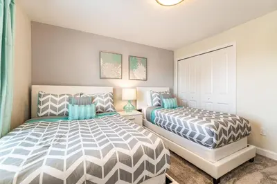 a bedroom with two beds in a room at Last Minute Disney Getaway Townhouse with Private Pool. Book Now 27412 in Kissimmee