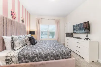 a bedroom with a bed and a dresser and a window at Last Minute Disney Getaway Private Pool Themed Bedrooms. Book Now 98613 in Kissimmee
