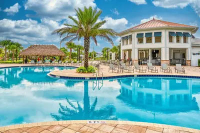 a swimming pool in front of a resort at Last Minute Disney Getaway Private Pool Themed Bedrooms. Book Now 17254 in Kissimmee
